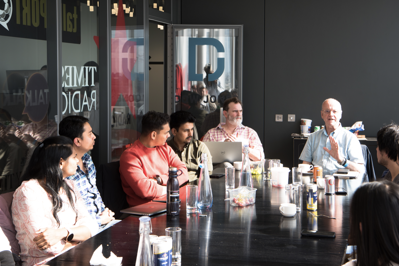 adserve colleagues in conversation overlooking the city